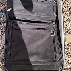 Large black checked luggage - used in excellent condition