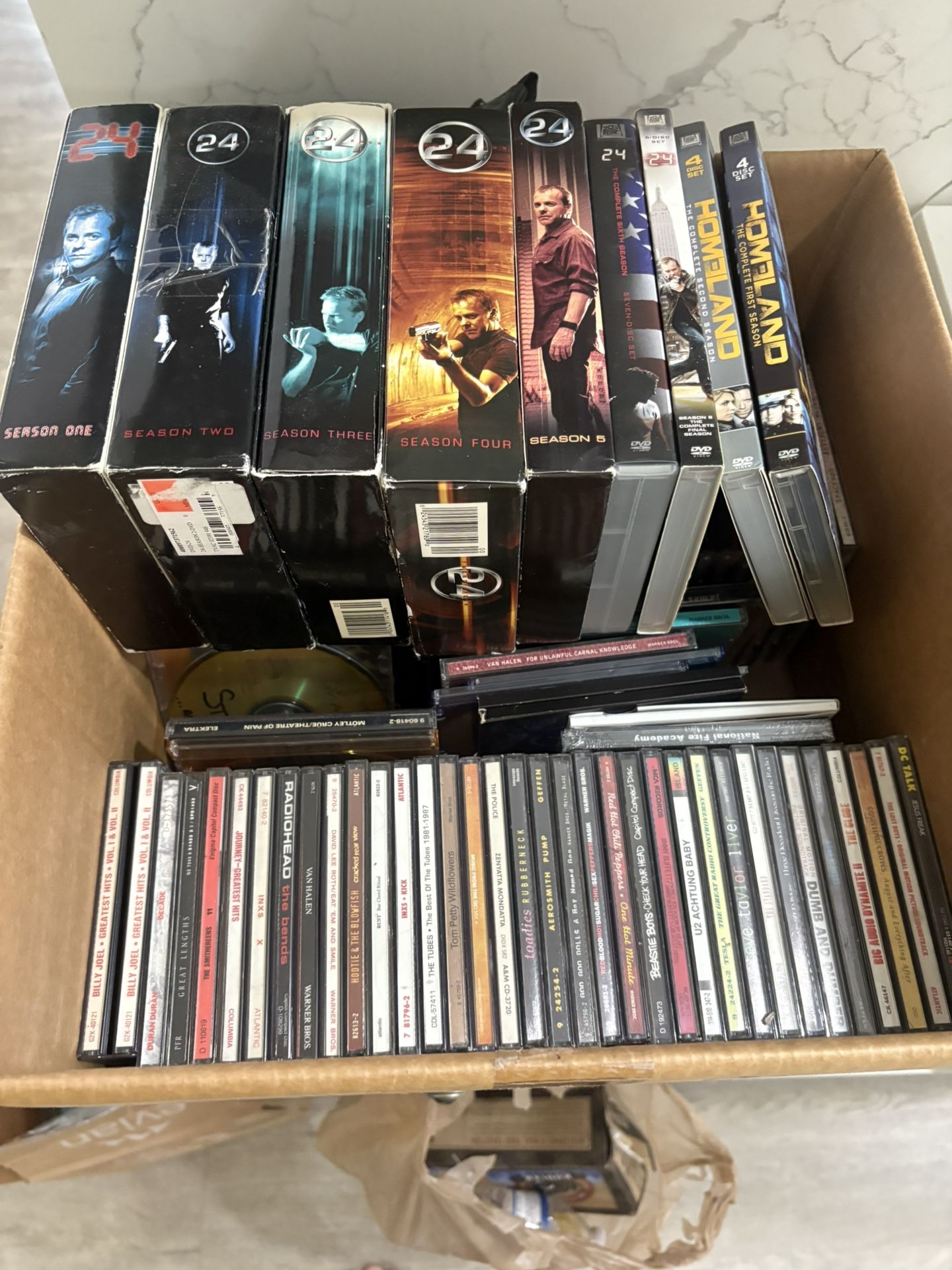 Multiple DVD movie sets and random audio CDs