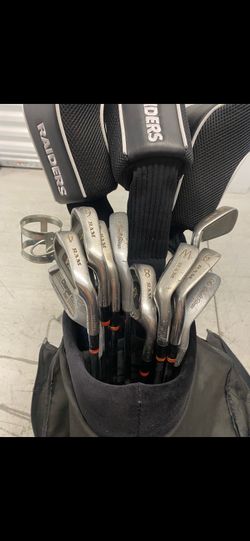 Golf clubs, accessories, and carrying case