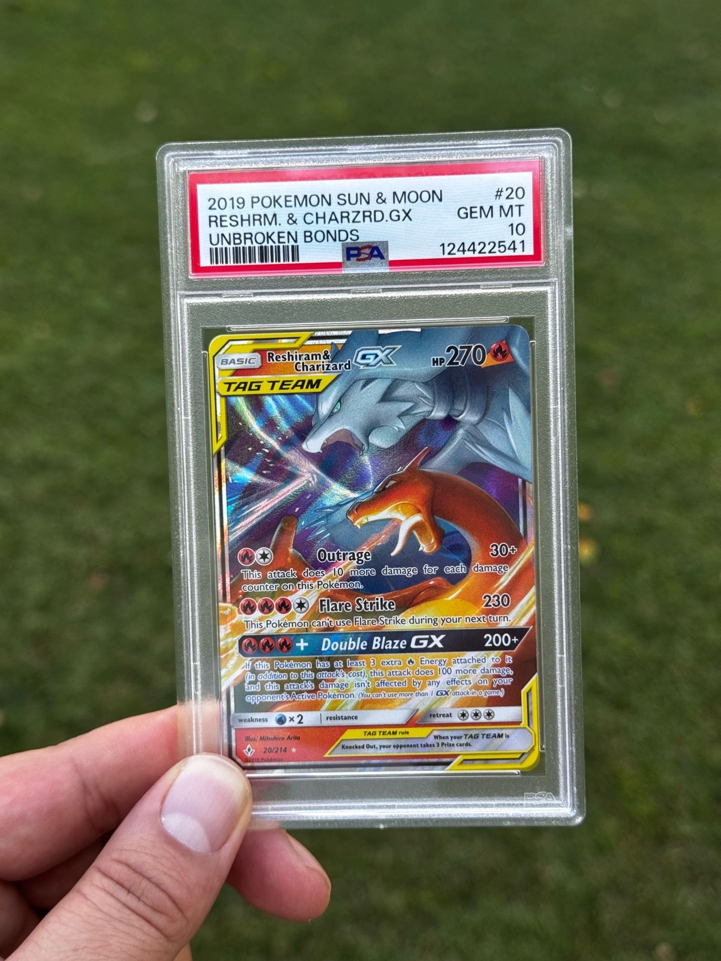 Reshiram & charizard gx tag team pokemon card