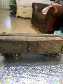 This is an HO scale weathered model boxcar.  