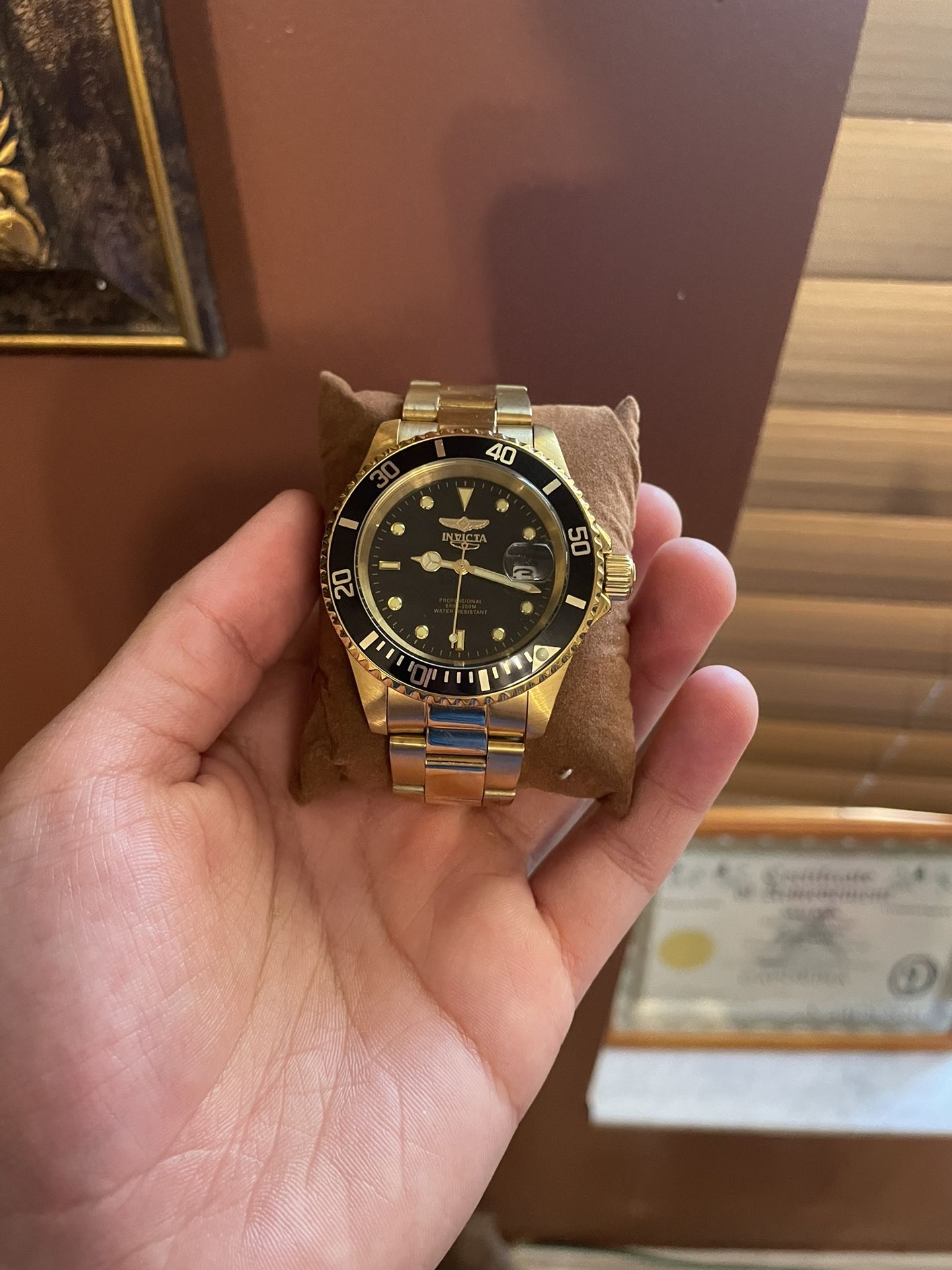 Gold Invicta watch