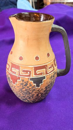 Vintage Sothwest Style Pottery Jug featuring southwest-inspired geometric patterns and a mottled, rustic finish on the lower body.
Made in Italy P8R60
