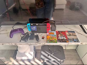 Nintendo Switch + Controllers & Games