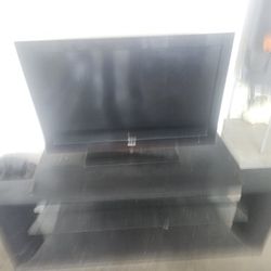 RCA 32INCH FLAT SCREEN TV AND STAND