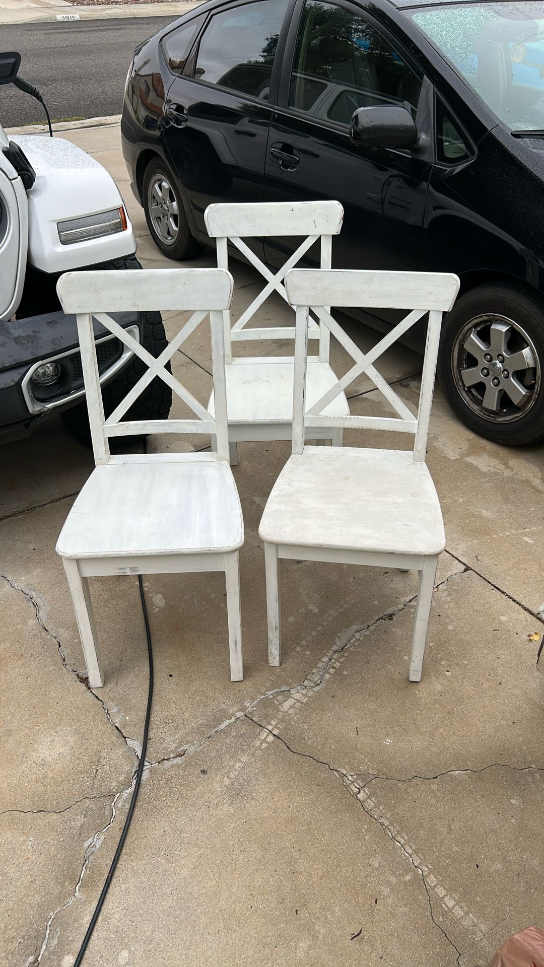 Three wooden chairs