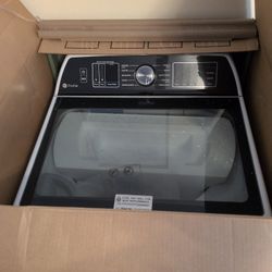A Brand New In The Box Top Load GE Washer 
