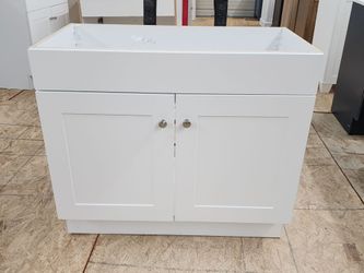 Brand New 36-in Vanity Cabinet in White Only. Sink not included.