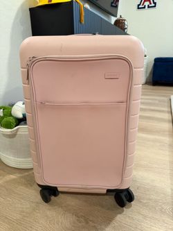 Away carry on with pocket and battery pack
