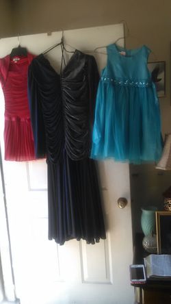 My grand daughter beautiful little. Red and light blue dresses and my dark blue and silver dress we are asking 40: obo
