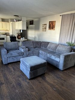 4-Piece Sectional Set W/ Ottoman
Reversible Loveseat + Reversible Loveseat W/USB Console & Cup Holders + Corner Wedge + Cocktail Ottoman

Color: Dark 