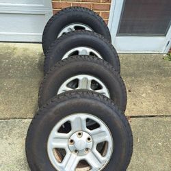16inch Stock Jeep Rims And Tires.  245/70R16 OBO