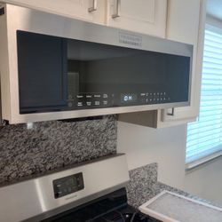 Microwave, Refrigerator, Dishwasher, And A small Washer 
