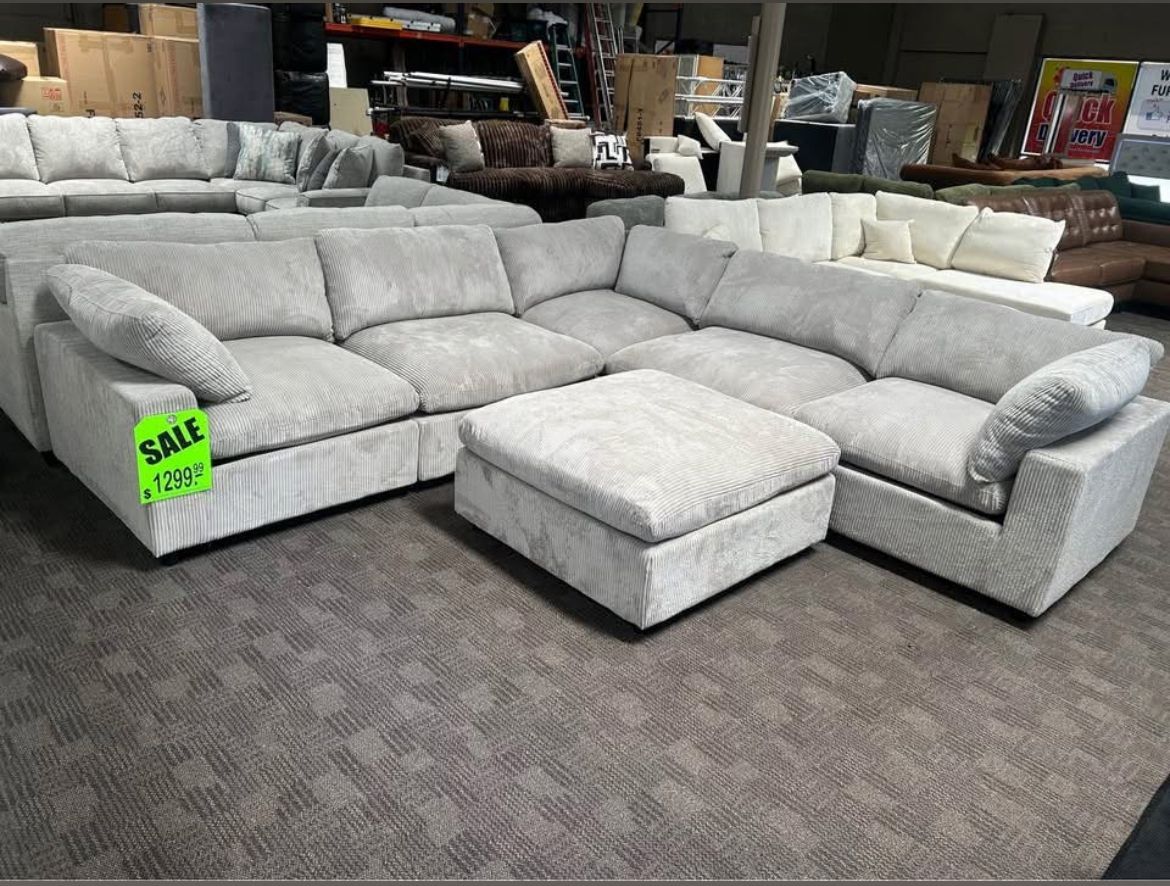 Light gray modular sectional and ottoman!