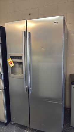 Like new LG side by side stainless steel refrigerator