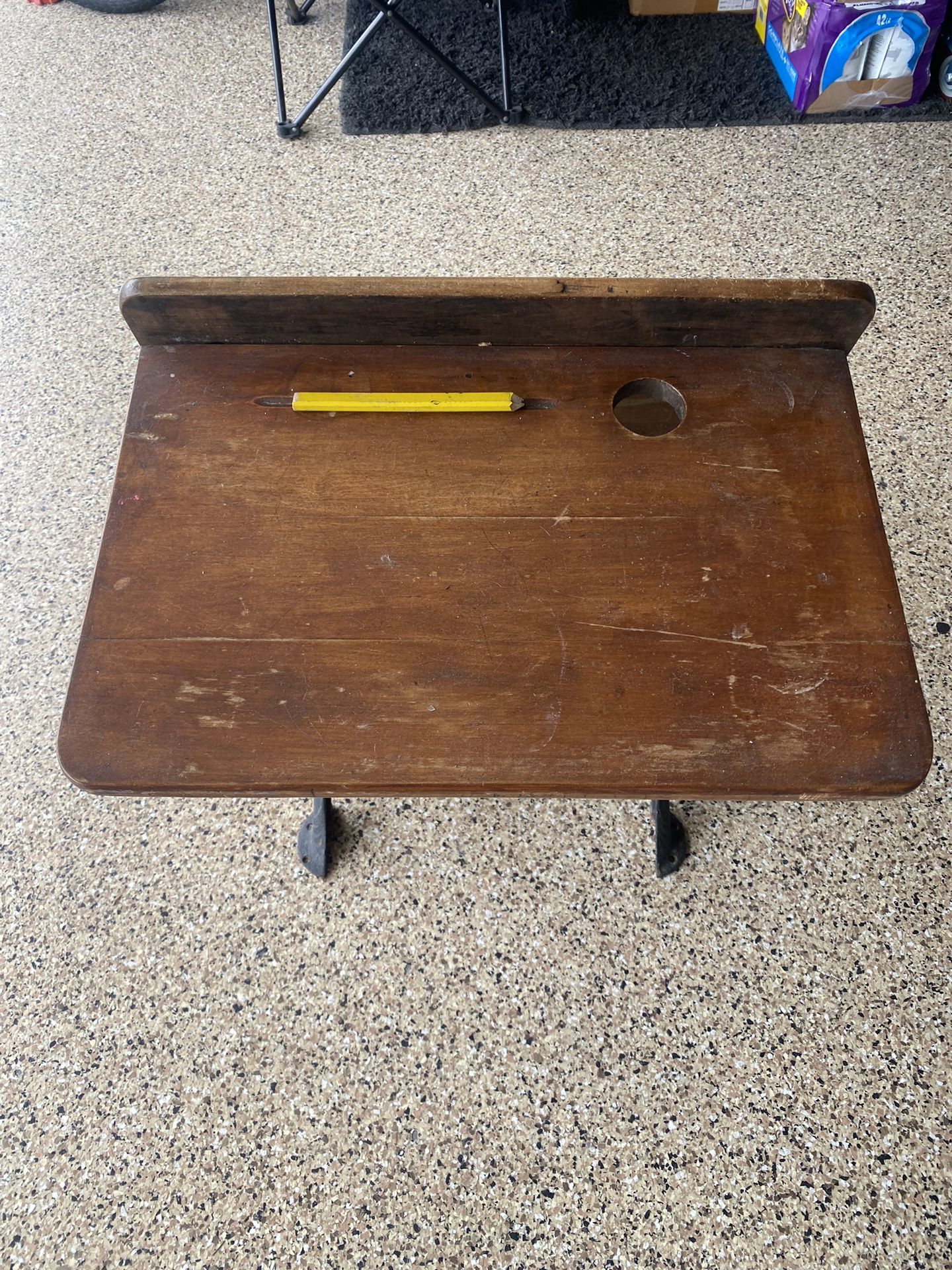 This is an antique school desk manufactured by "Peabody-Stigglemann Co