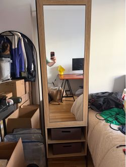 Open wardrobe with mirror