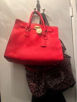 Reddish- orange Michael Kors purse
