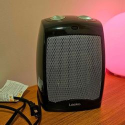 Modern Lasko Desktop Electric Ceramic Space Heater:
Adjustable Thermostat,
2 Heat Settings and Fan.