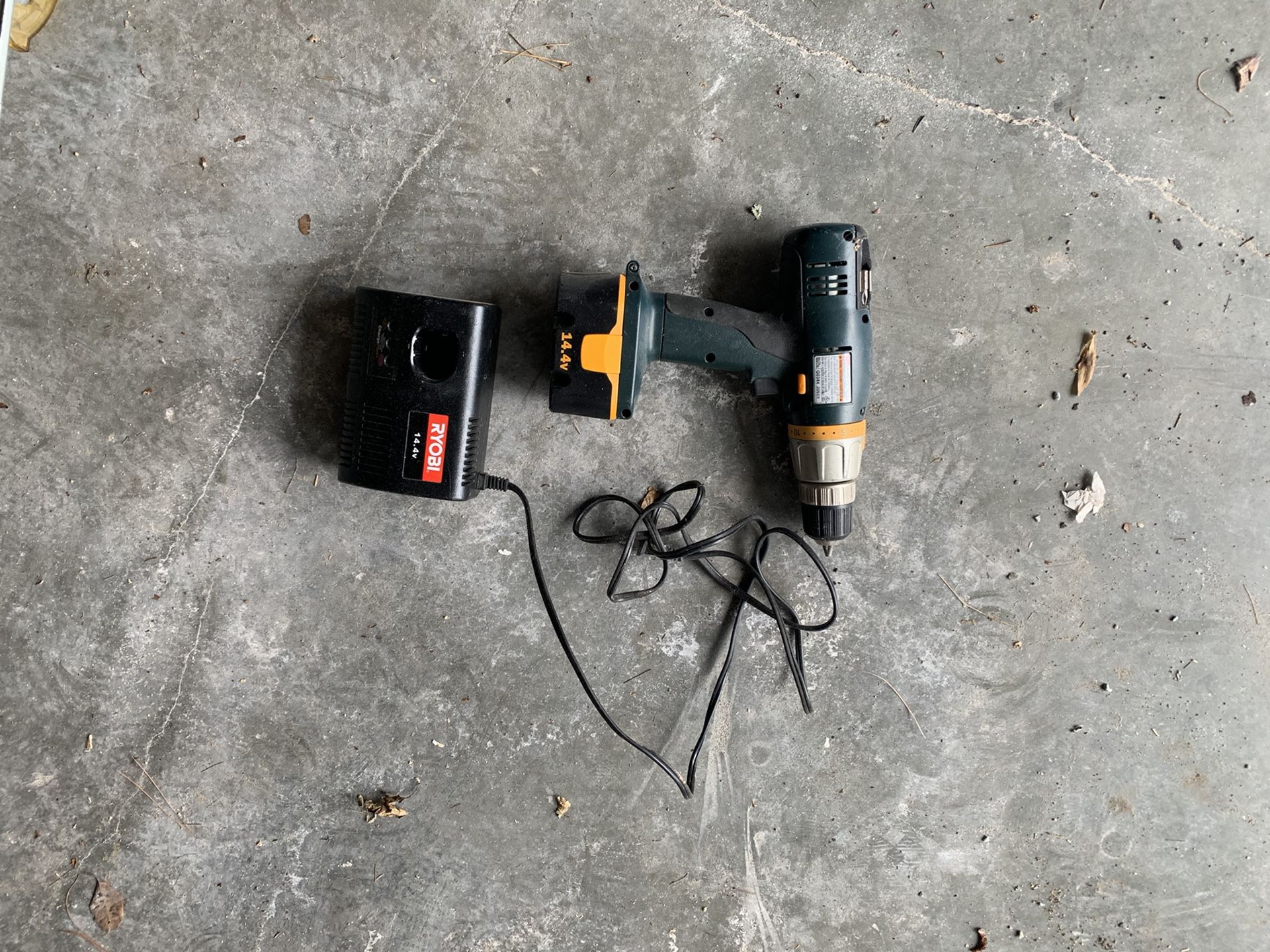 Cordless Ryobi drill with charger and battery