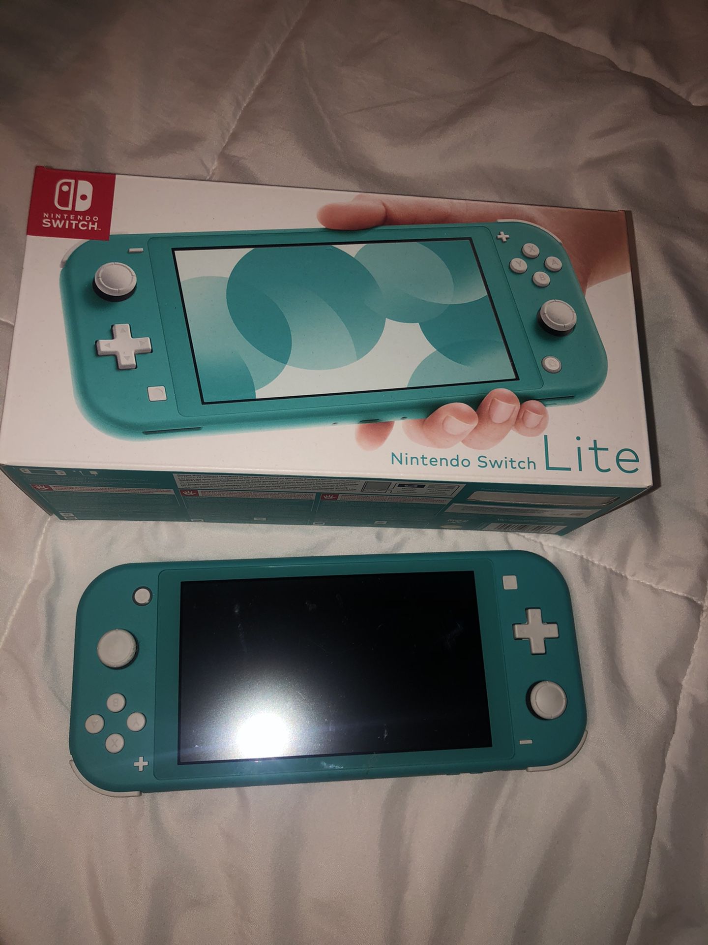 Nintendo switch lite + 2 games + charger
