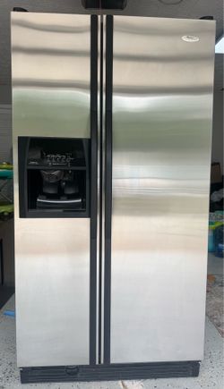 Whirlpool stainless steel side-by-side refrigerator in very good condition.
