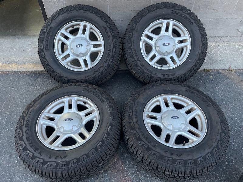 Ford Explorer 16 inch aluminum rims and all terrain tires. Fits Ranger - T02398