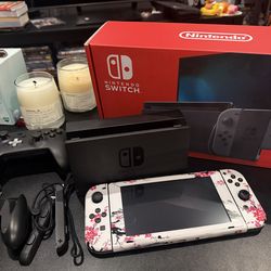 Nintendo Switch with accessories, controllers, case, and games