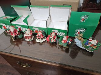 6 7up Santa Claus Christmas ornaments.