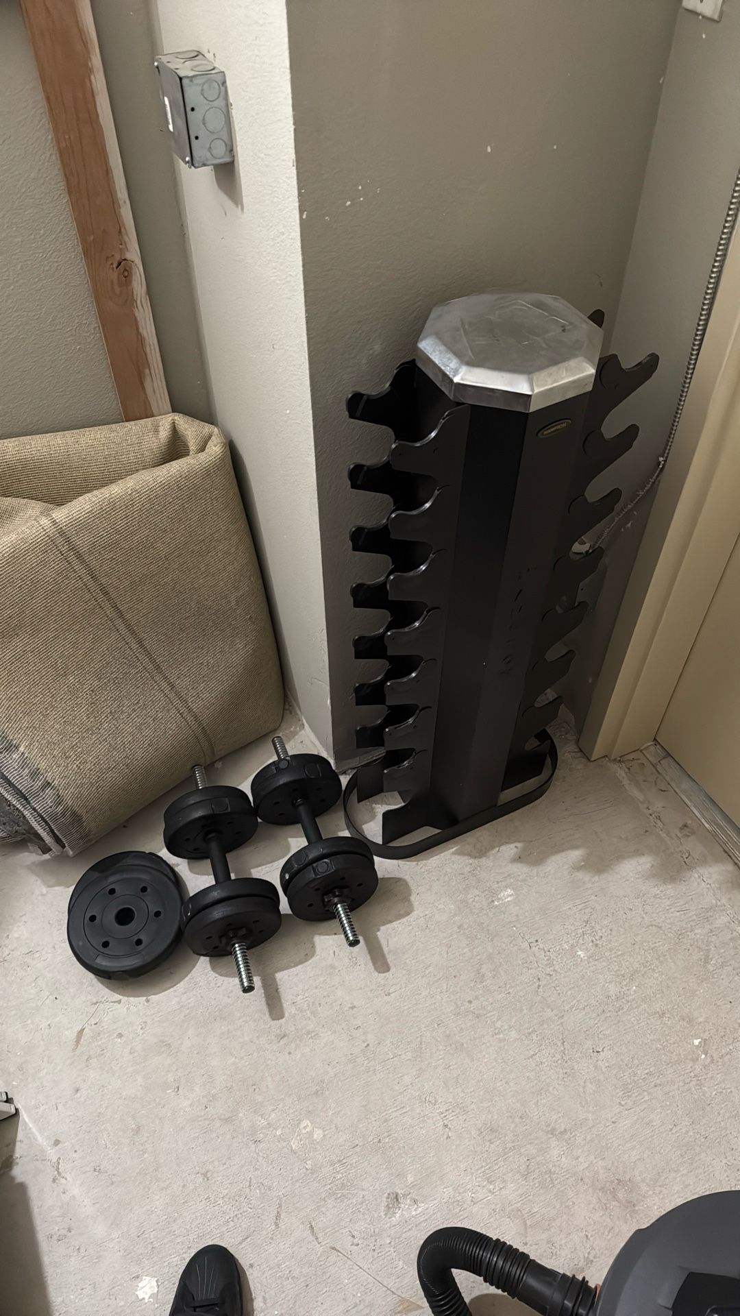 Dumbbell Rack And Some Plastic Weights