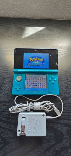 Teal 3ds with 64gb memory card and games