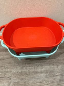 Set of two plastic sensory play tubs in red and light blue