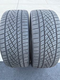 Pair of Continental tires 275/40/22 85%