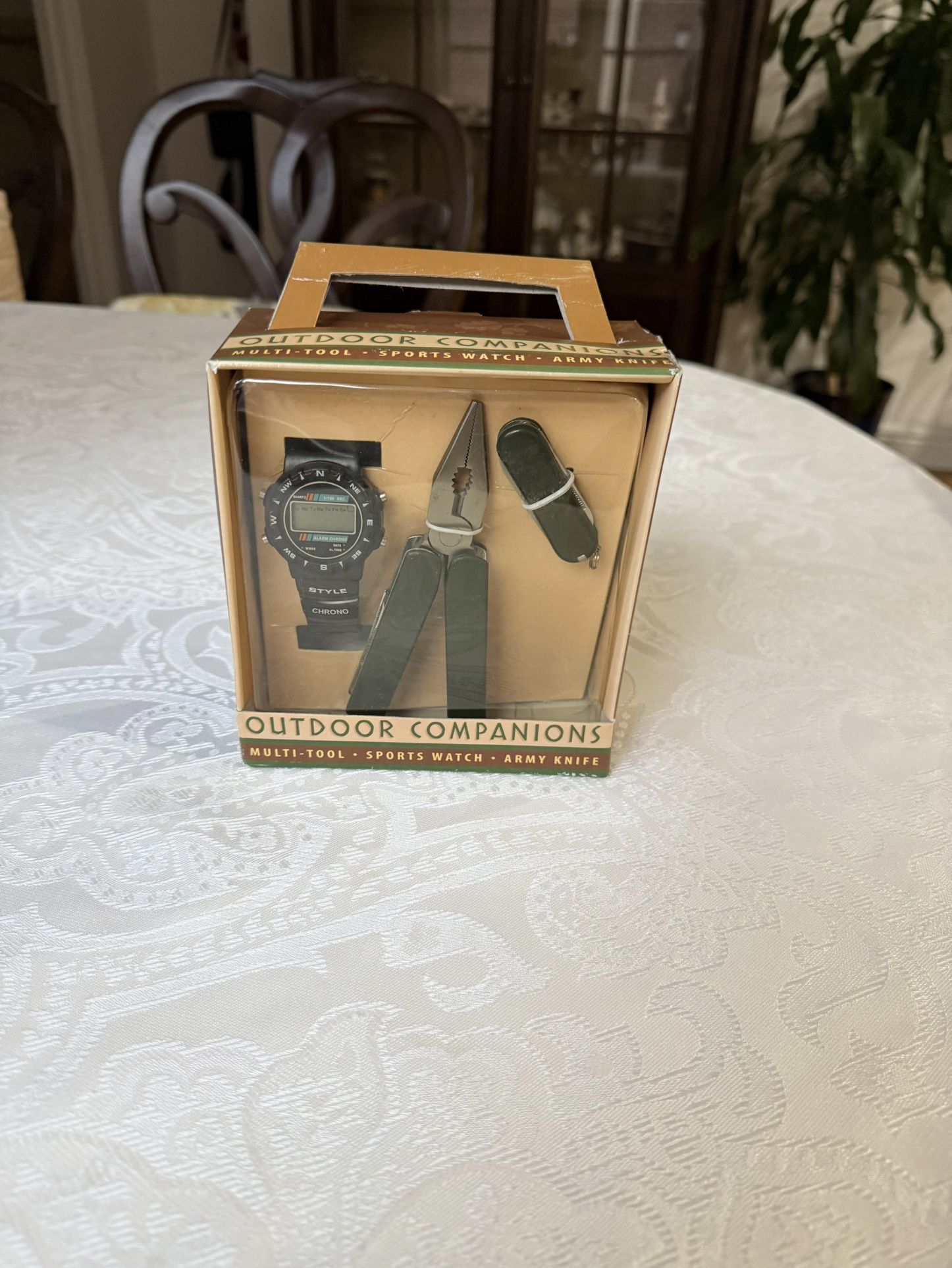 "Outdoor Companions" set, which includes a multi-tool, a sports watch, and an army knife. New. Still in original packaging. Collectible. Designed for 