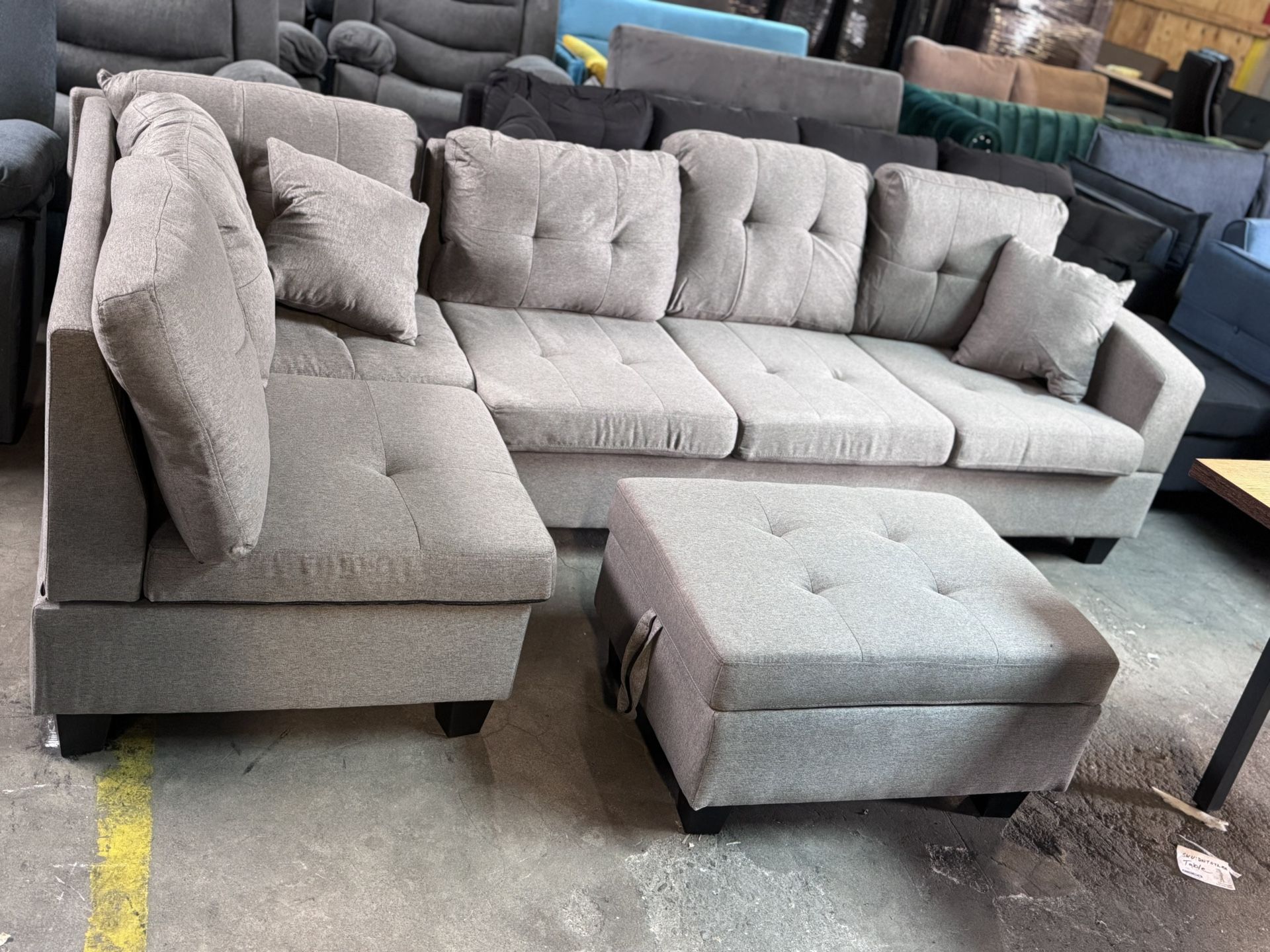 gray sectional with storage ottoman