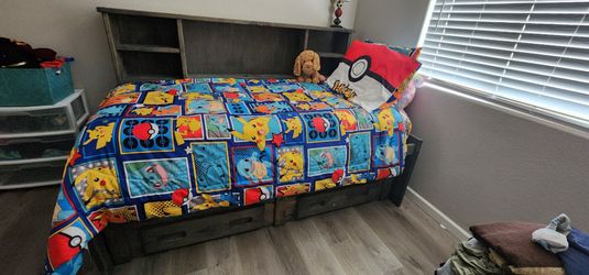 Twin bed with 4 drawers and under bed storage with Pokémon bedding