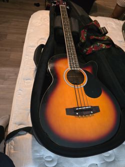 4 string acoustic base guitar with case.