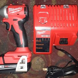 Milwaukee 1/4" Impact Drill, Battery, And Charger