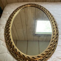 Antique oval glass mirror