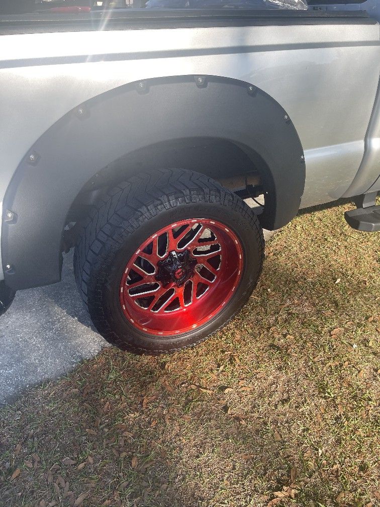 22×10Rims With 35 Inch Tires All 4In Good Condition