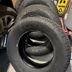 (4) GOODYEAR WRANGLER FORTITUDE HT TIRES - 265/65/18