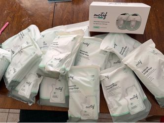 Breast pump with storage bags