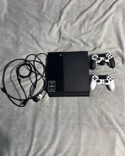 PS4 console with 2 controller and cords