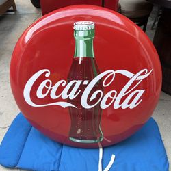 Coca cola button 36 inch porcelain the field is really clean the edges are alittle chipped up