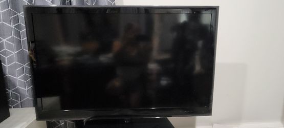 Black Flat Screen TV with Stand LG