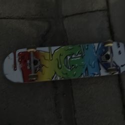DGK rainbow drip skate board