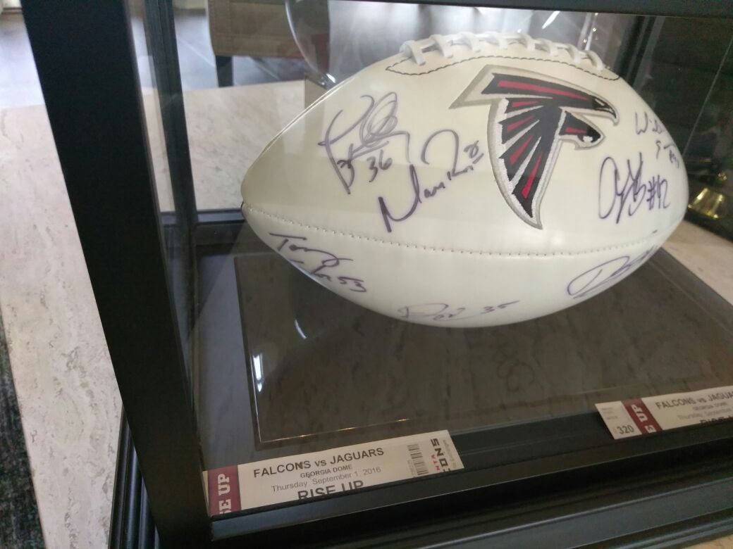 Authentic signed Matt Ryan and 7 team player's in glass display case with JSA certificate of authenticity