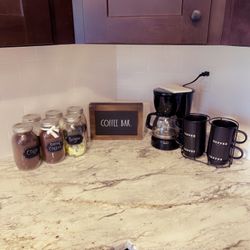 coffee bar with jar cups and machine 