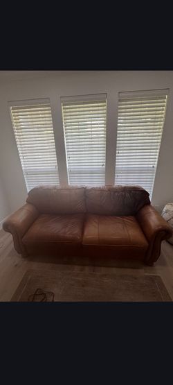 Beautiful brown leather couch and chair set
