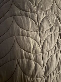 Tan Quilted Bedspread with Leaf Pattern